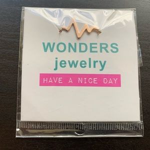 Gold heartbeat necklace